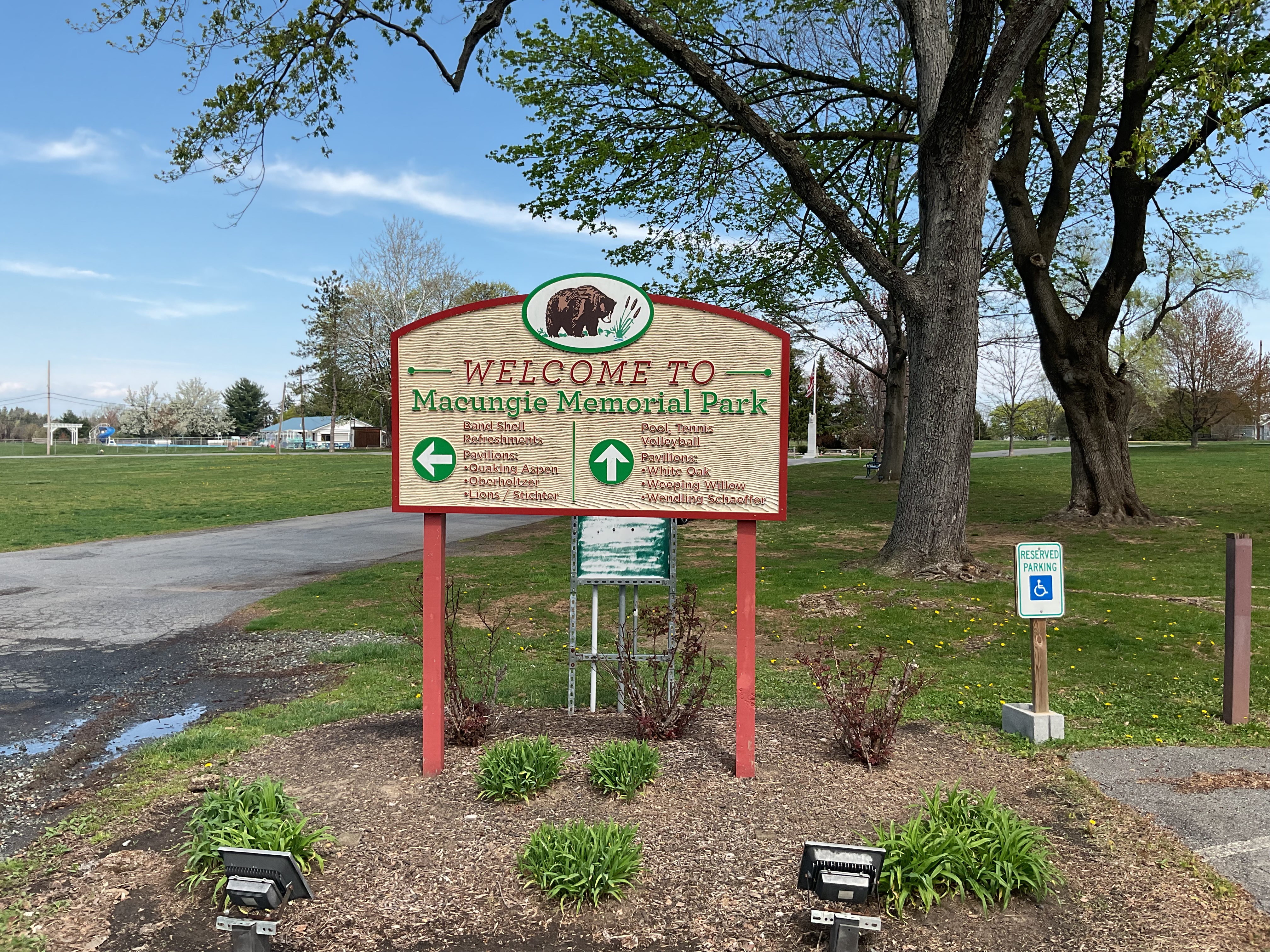 Entrance to Macungie Park - Welcome sign and paved walkway. Includes sign for handicap parking.